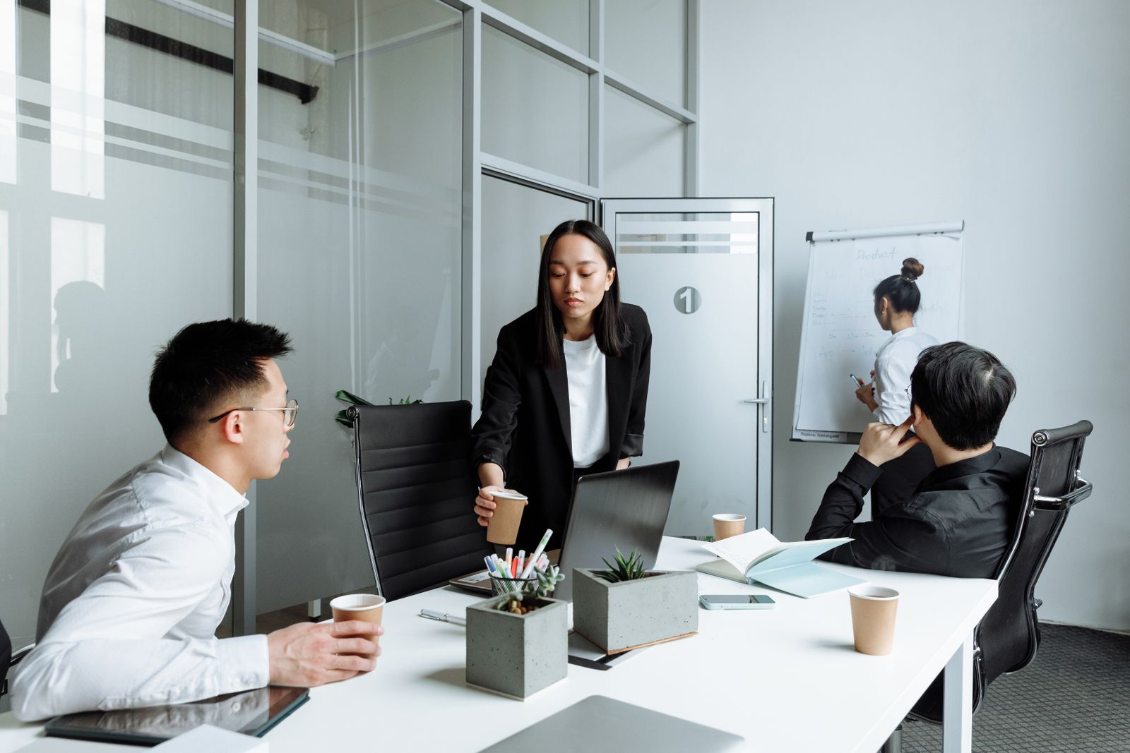 A diverse team in a planning meeting around a desk
